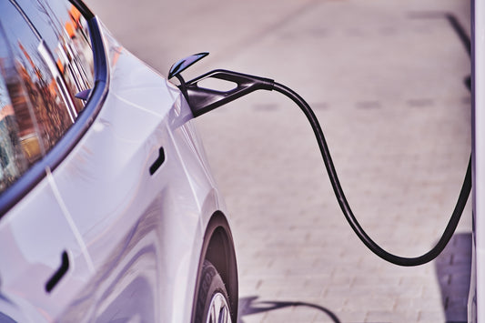 an electric car plugged into a charging station