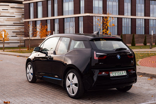 a black car parked in front of a building