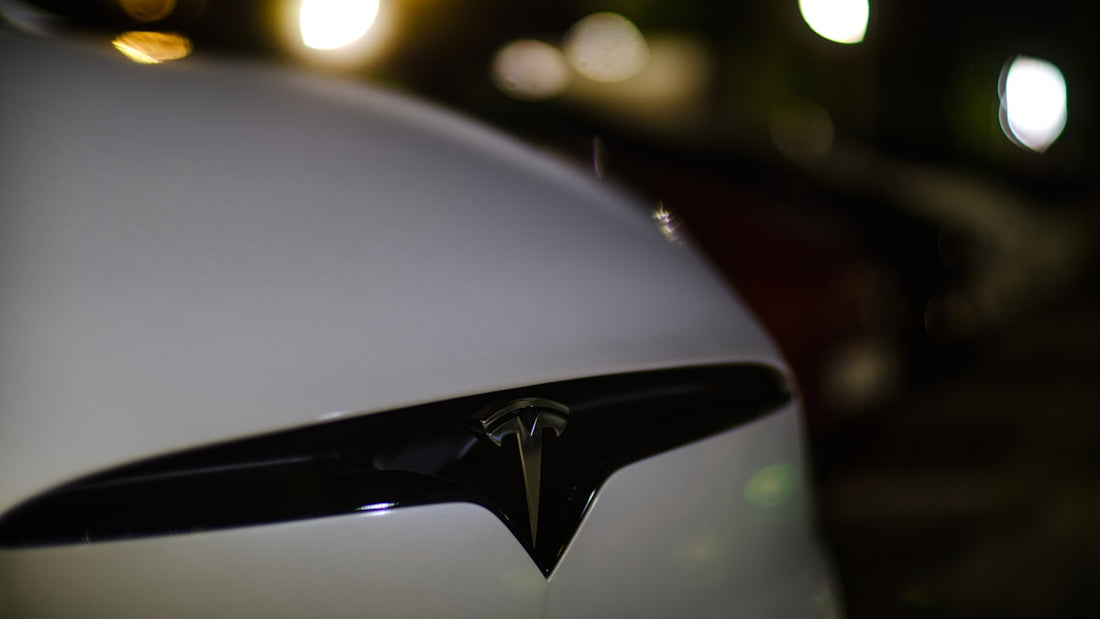 a close up of the front of a white tesla car