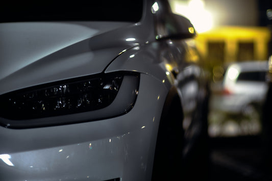a close up of the front of a white car