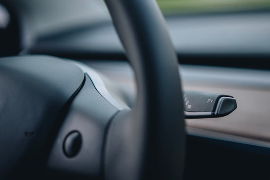 a close up of a steering wheel of a car
