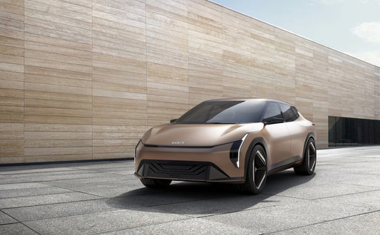 an electric car parked in front of a building